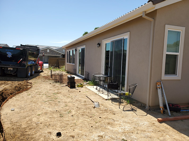 12x34 Attached, under eave mount, Durawood flatwood patio cover with Diamond ends. Color: Sierra Snow Trim Color: Sierra Snow  Electrical: Fan  Concrete: Three footings - Fair Oaks, CA