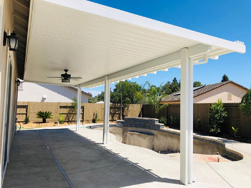 12x34 Attached, under eave mount, Durawood flatwood patio cover with Diamond ends. Color: Sierra Snow Trim Color: Sierra Snow  Electrical: Fan  Concrete: Three footings - Fair Oaks, CA