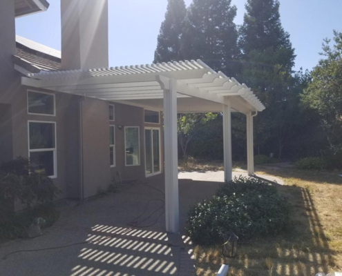 14'x10' lattice, 14x18 solid Durawood attached, under eave mount patio cover with scallop end caps. Color: Sierra Snow - Loomis, CA