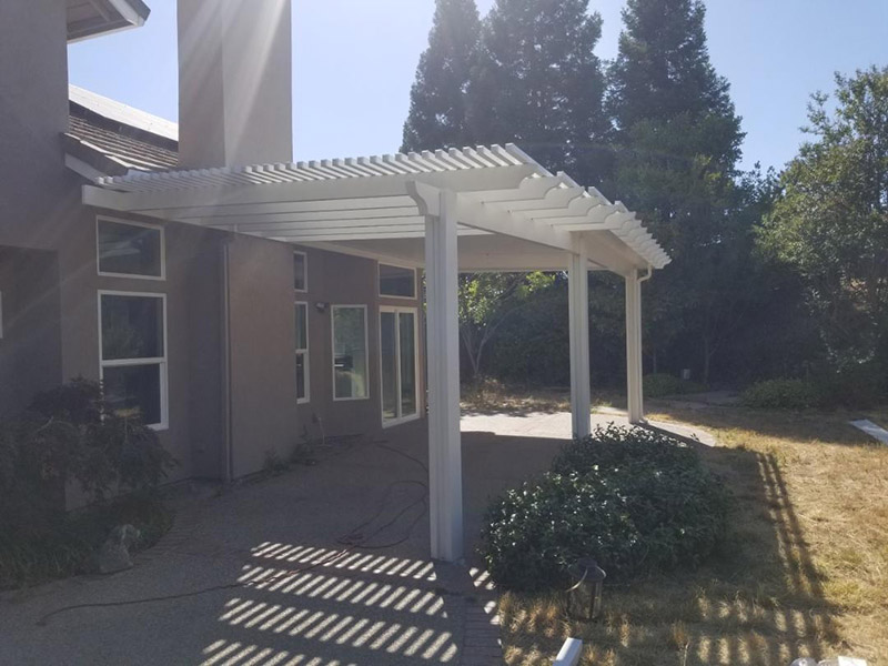 14'x10' lattice, 14x18 solid Durawood attached, under eave mount patio cover with scallop end caps. Color: Sierra Snow - Loomis, CA
