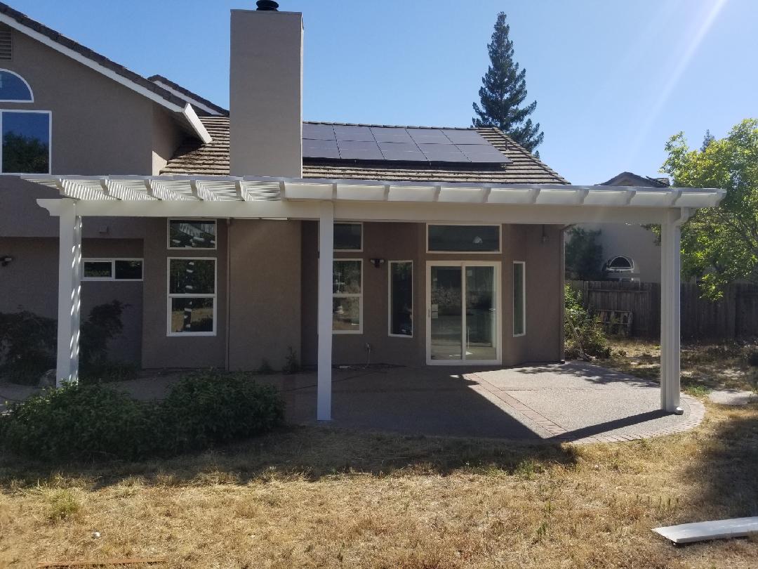 14'x10' lattice, 14x18 solid Durawood attached, under eave mount patio cover with scallop end caps. Color: Sierra Snow - Loomis, CA