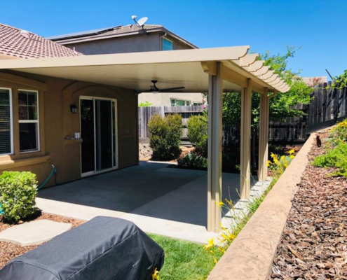 19'x19' total, 17'x19' solid + 2'x19' lattice wall attached Flatwood patio cover with corbel end caps Color: California sand, trim: Southwood Electrical: 1 fan, 1 outlet - Folsom, CA