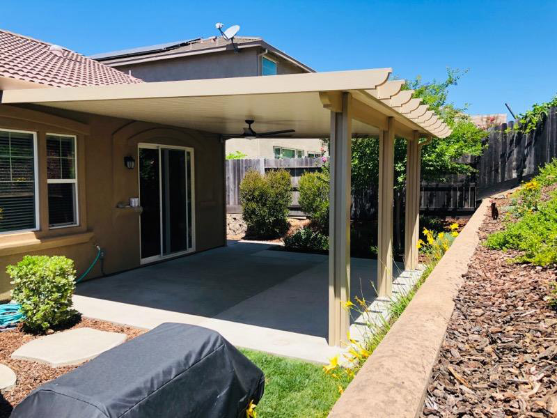 19'x19' total, 17'x19' solid + 2'x19' lattice wall attached Flatwood patio cover with corbel end caps Color: California sand, trim: Southwood Electrical: 1 fan, 1 outlet - Folsom, CA