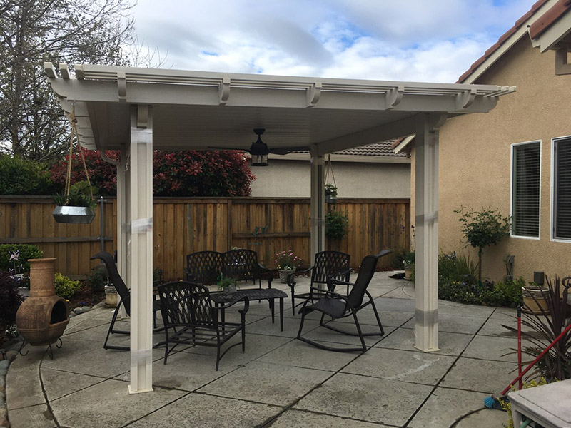 12x12 solid flatwood patio cover w/lattice, 14x14 overall with Corbel end caps. Color